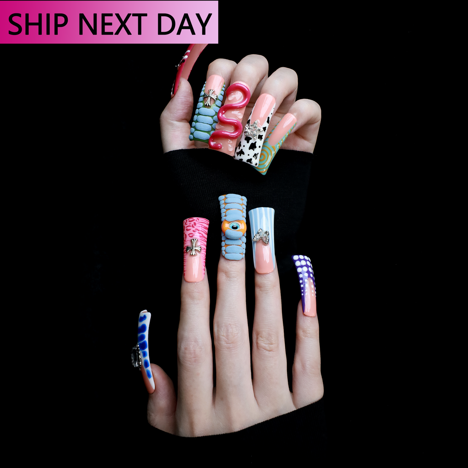 Two hands showcase the Avant-Garde 3D Extra Long Duck Nails by We Do Nails, featuring blue textures, cow print, pink patterns, and colorful designs against a black background. Ship Next Day text highlights custom size and nail measurement personalization options.